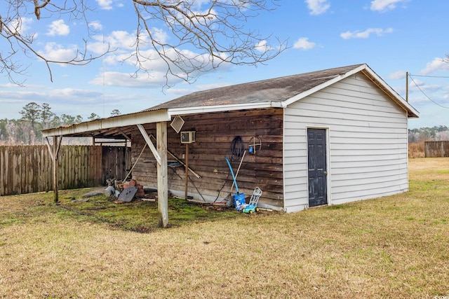 view of outbuilding with an outbuilding and fence