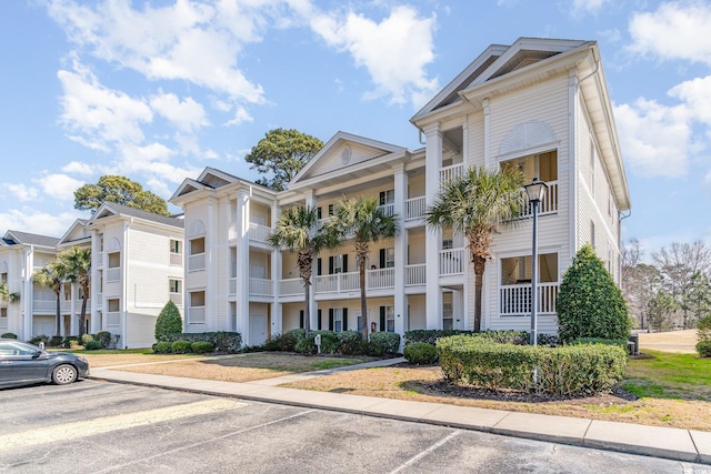 view of property with uncovered parking