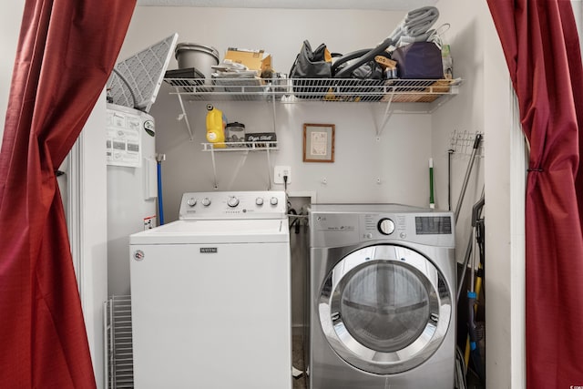 laundry room featuring laundry area and washer and clothes dryer