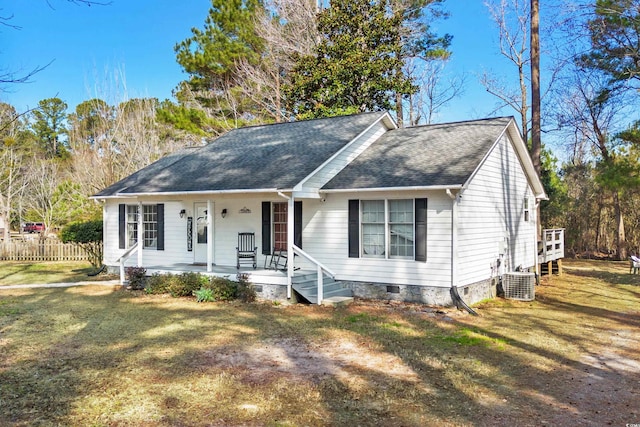 ranch-style house featuring a porch, fence, roof with shingles, crawl space, and a front lawn