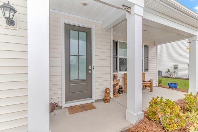 doorway to property with covered porch