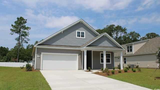 view of front of house featuring cooling unit, fence, an attached garage, driveway, and a front lawn