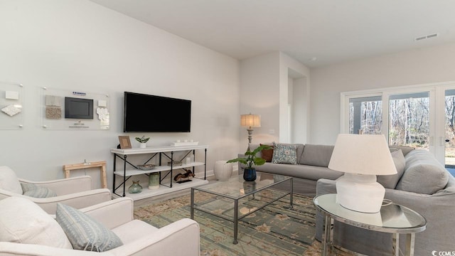 living room featuring visible vents