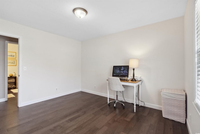 home office featuring wood finished floors and baseboards