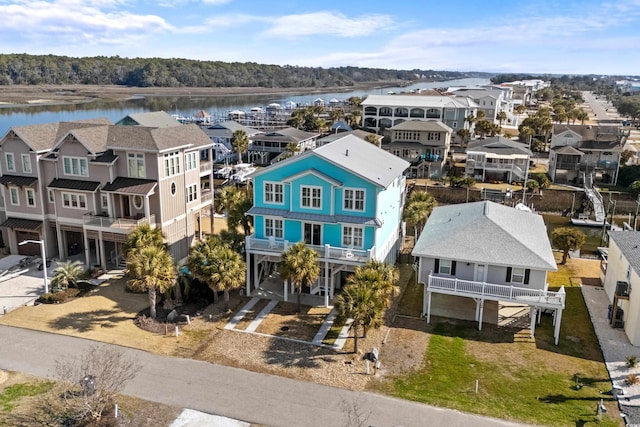 bird's eye view featuring a water view and a residential view
