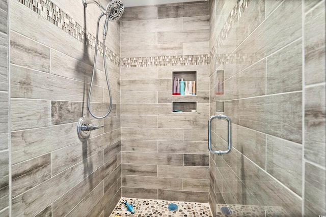 full bath with a shower stall