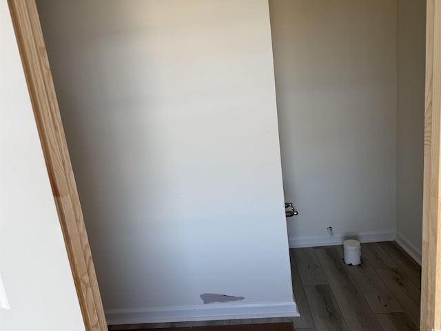 bathroom featuring baseboards and wood finished floors