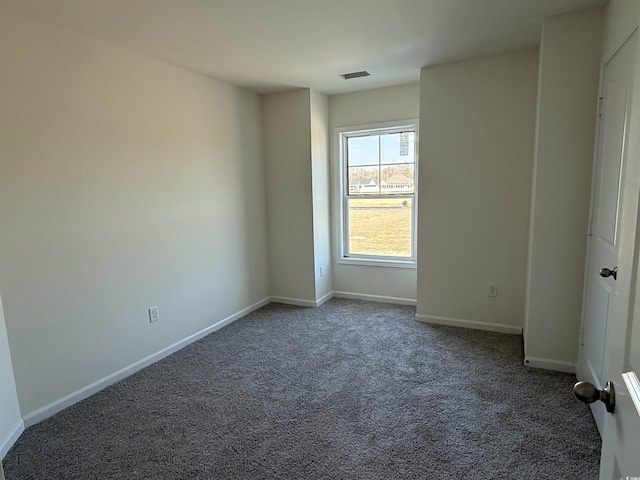 unfurnished room featuring visible vents, baseboards, and carpet flooring