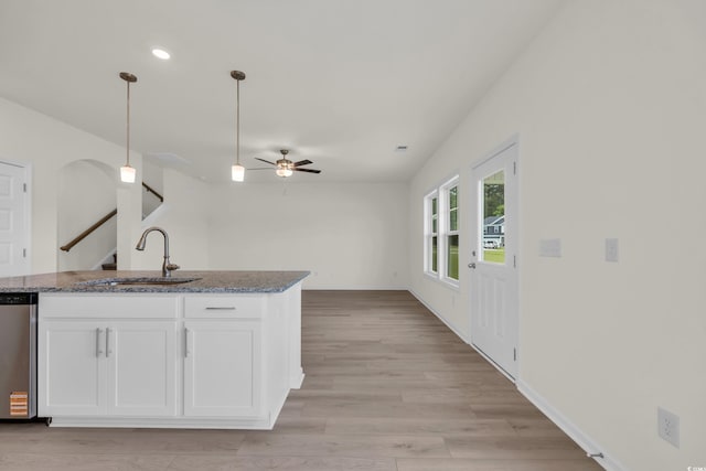 1064 Jase Dr, Longs, SC 29568 - kitchen featuring a sink, ceiling fan, white cabinetry, pendant lighting, and dark stone countertops