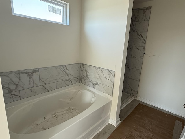 bathroom featuring a garden tub