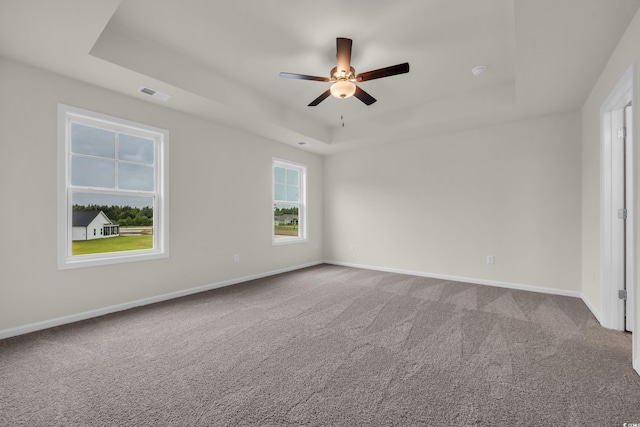 1064 Jase Dr, Longs, SC 29568 - carpeted empty room with a raised ceiling, ceiling fan, and baseboards
