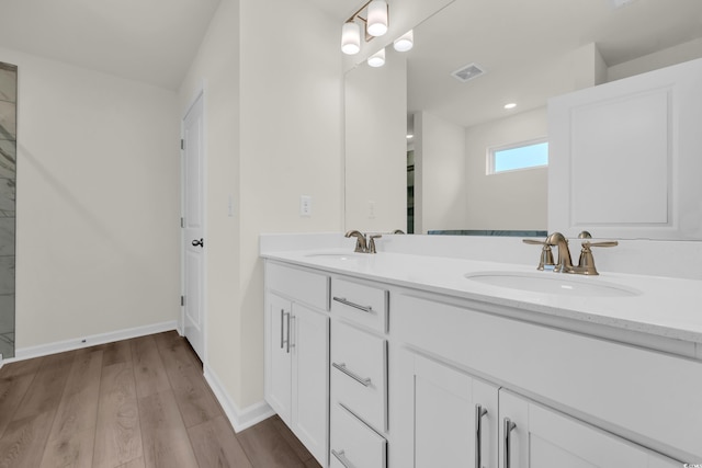1064 Jase Dr, Longs, SC 29568 - full bathroom featuring wood finished floors, double vanity, and baseboards
