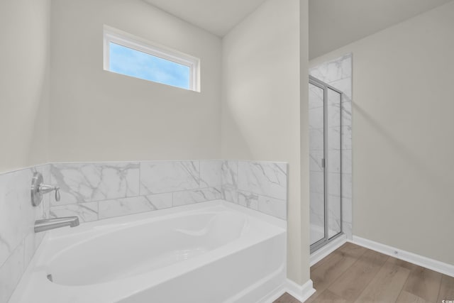 1064 Jase Dr, Longs, SC 29568 - full bath with a stall shower, a garden tub, wood finished floors, and baseboards
