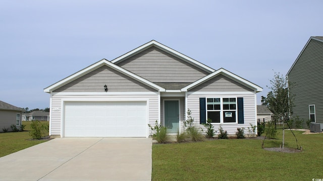 view of front of house with concrete driveway, an attached garage, a front yard, and central air condition unit