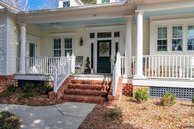 doorway to property featuring a ceiling fan and covered porch