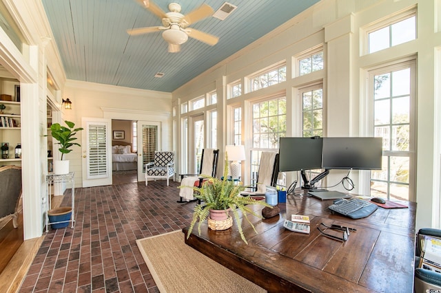 sunroom / solarium with a ceiling fan, wooden ceiling, and visible vents