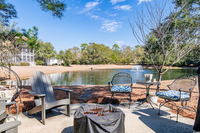 view of patio with a water view