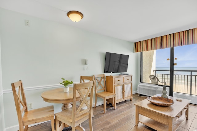 interior space with baseboards and wood finished floors