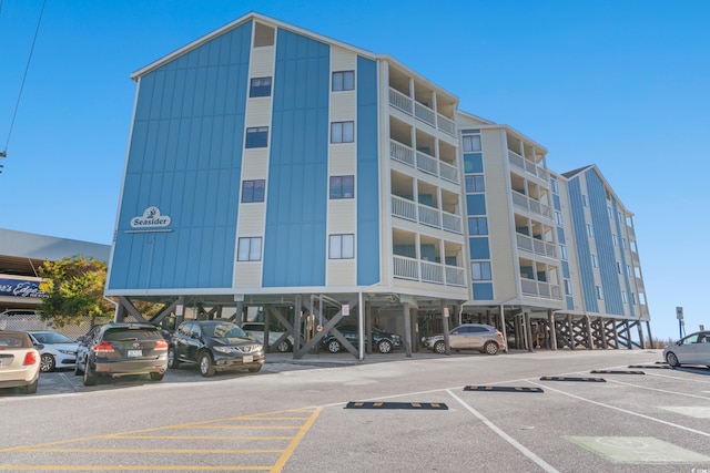 1000 N Waccamaw Dr Unit 205, Murrells Inlet, SC 29576 - view of building exterior featuring covered and uncovered parking