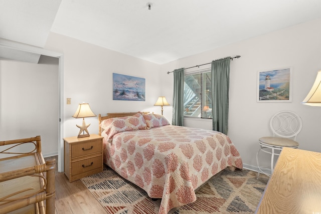 1000 N Waccamaw Dr Unit 205, Murrells Inlet, SC 29576 - bedroom with baseboards and light wood-style flooring