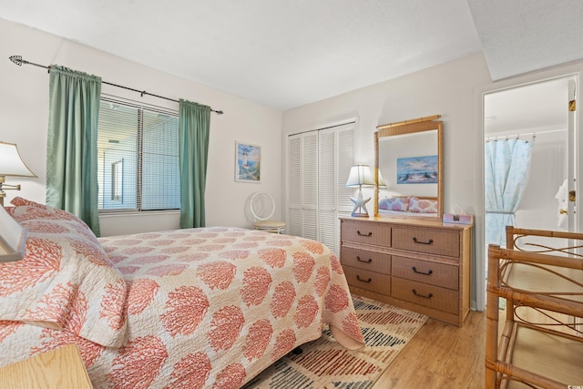 1000 N Waccamaw Dr Unit 205, Murrells Inlet, SC 29576 - bedroom with light wood-style floors and a closet
