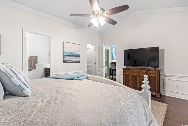 bedroom featuring lofted ceiling, dark wood-style floors, ornamental molding, and wainscoting