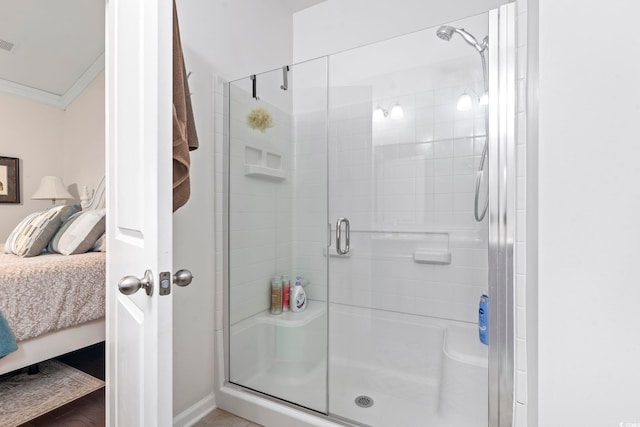 full bathroom with visible vents, crown molding, a shower stall, and ensuite bathroom