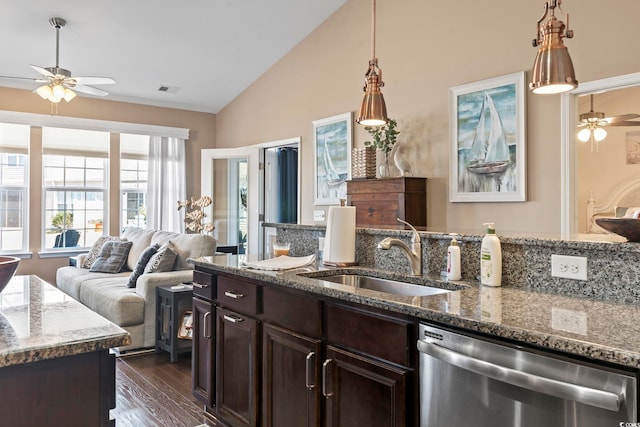 kitchen with dishwasher, open floor plan, dark brown cabinets, stone counters, and a sink