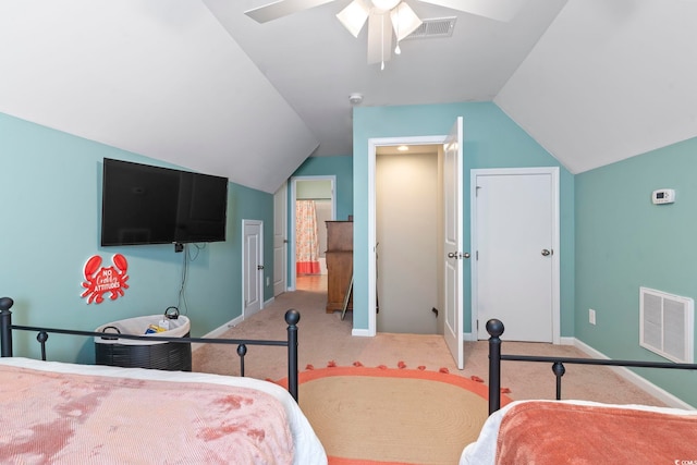 bedroom with light carpet, lofted ceiling, visible vents, and baseboards