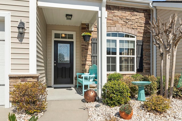 view of exterior entry featuring stone siding