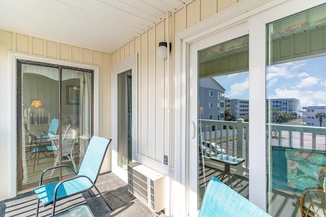 balcony with a sunroom and a view of city