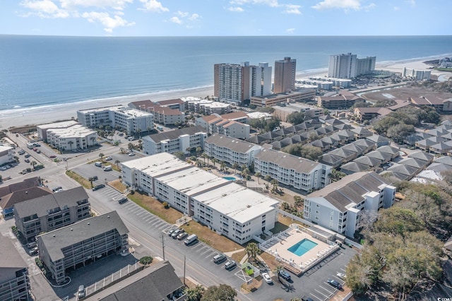 bird's eye view with a view of city, a water view, and a beach view