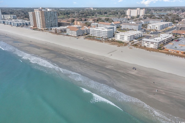 bird's eye view with a view of city, a water view, and a beach view