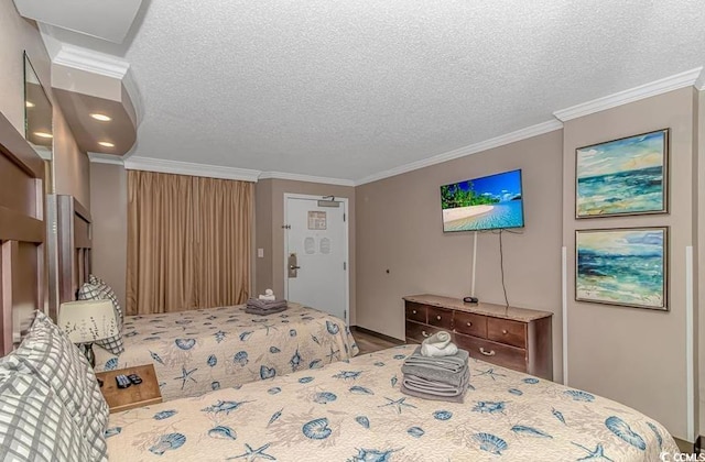 bedroom featuring crown molding and a textured ceiling