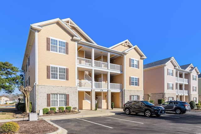 view of property featuring uncovered parking
