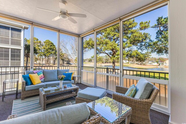 sunroom / solarium with a ceiling fan