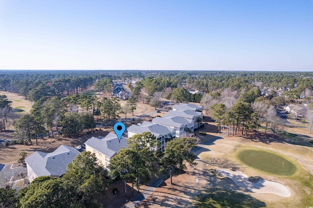 birds eye view of property with golf course view and a residential view