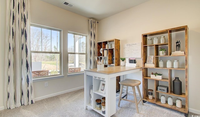 carpeted office with baseboards and visible vents