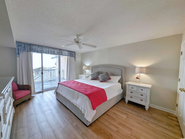 bedroom featuring access to exterior, light wood-style floors, ceiling fan, a textured ceiling, and baseboards