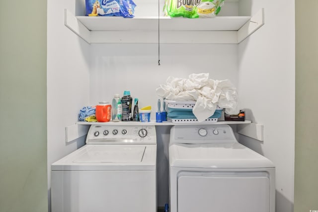 laundry room featuring laundry area and washing machine and clothes dryer