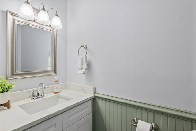 bathroom with wainscoting and vanity