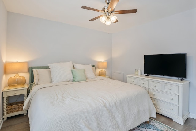 bedroom featuring a ceiling fan and wood finished floors