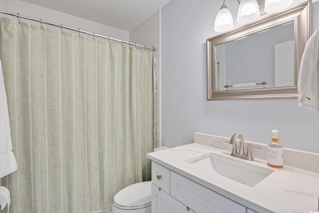 full bath featuring toilet and vanity