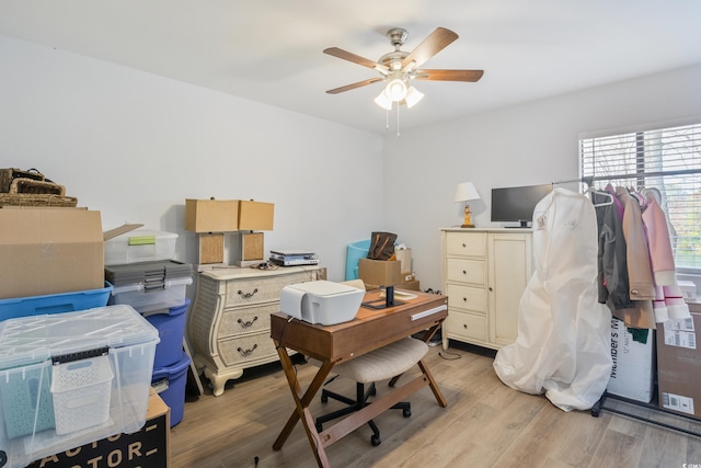 home office featuring light wood-type flooring and ceiling fan