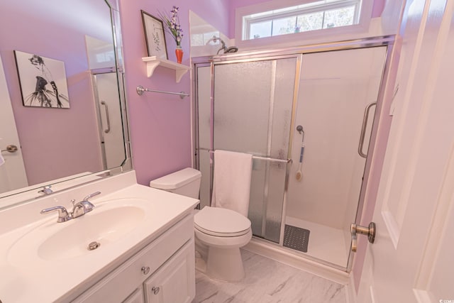 full bath with marble finish floor, toilet, vanity, and a stall shower