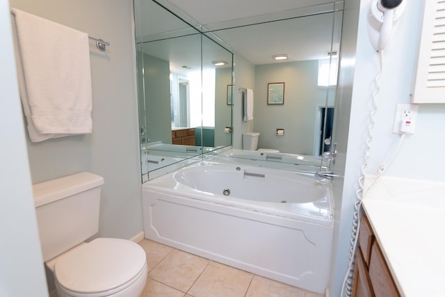 full bathroom with tile patterned flooring, a jetted tub, toilet, and vanity