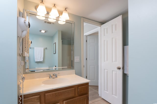 bathroom featuring vanity, tile patterned floors, and visible vents