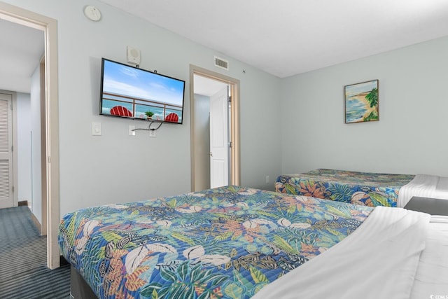 carpeted bedroom with visible vents