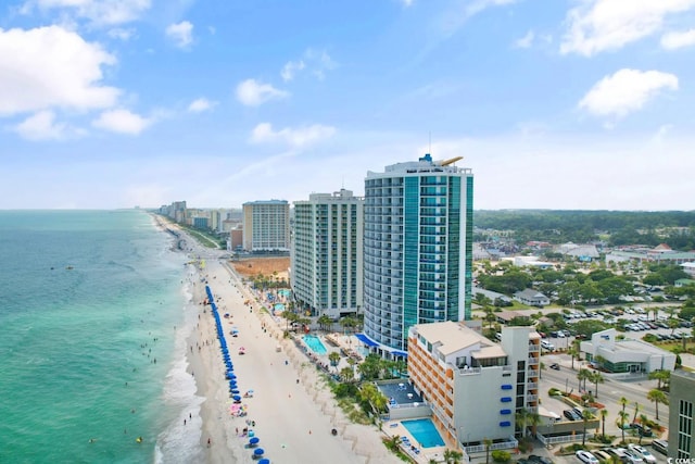 aerial view with a water view, a beach view, and a city view