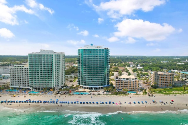 aerial view featuring a water view, a view of city, and a view of the beach